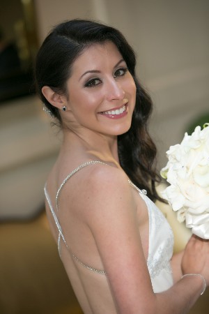 Smiling Bride Holding Flowers